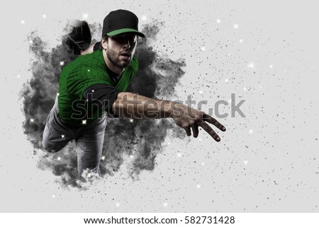 Pitcher Baseball Player with a green uniform coming out of a blast of smoke .