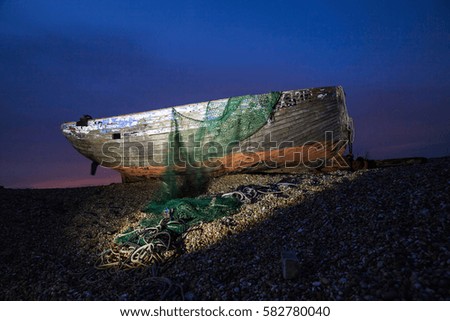 Shipwreck in the dusk on England`s coastline