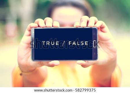 smart phone display true or false on screen Royalty-Free Stock Photo #582799375