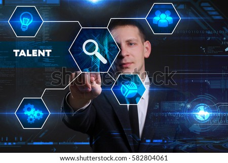 Business, Technology, Internet and network concept. Young businessman working on a virtual blackboard of the future, he sees the inscription: talent 