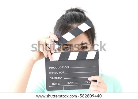 Portrait of young pretty Asian chic woman hand hold clapperboard. Film production and movie making concept