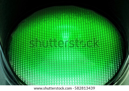 Closeup green traffic light.Macro photo.Street.Concept green light
