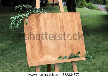 Wooden easel with a board. 
