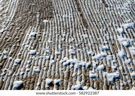frozen sand with ice blocks. abstract texture in natural beach