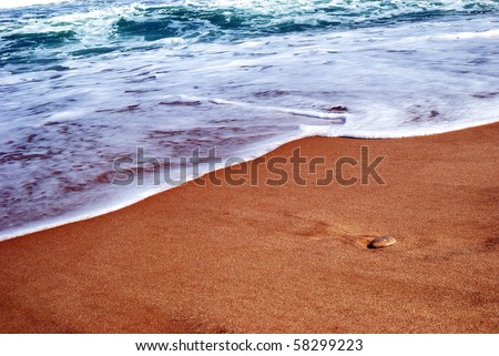 Waves running on sandy coast of Mediterranean sea