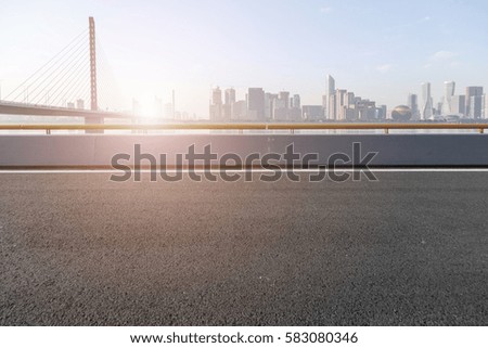 Road surface and Hangzhou skyline