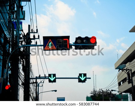 Traffic lights and crossing sign on blue skies in evening
