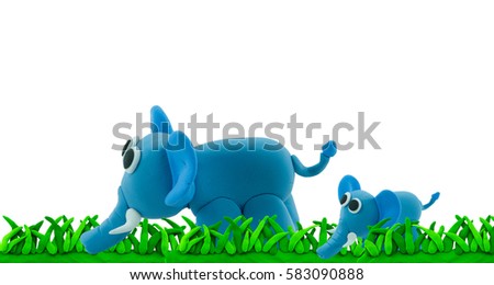 plasticine elephant and son walk on grass in concept family
