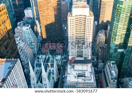 New York City Manhattan skyline aerial view with skyscrapers, tall building and street before sunset. 