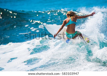 Riding the waves. Costa Rica, surf paradise Royalty-Free Stock Photo #583103947