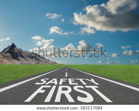 Safety First concept with motivational quote on highway