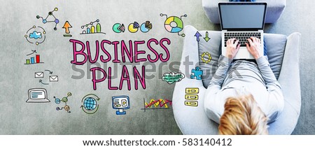 Business Plan text with man using a laptop