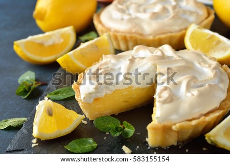 Lemon pie with meringue on a blue background