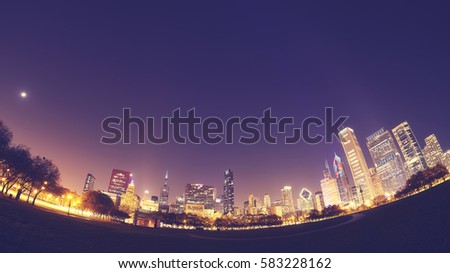 Fisheye lens color toned picture of Chicago skyline at night, USA.