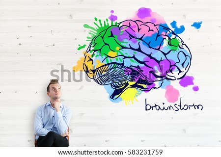 Thoughtful businessman with colorful brain sketch. Brainstorm concept