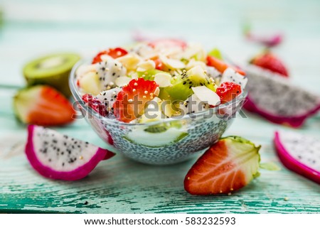 Dragon fruits and other exotic fruits with chia seeds for healthy breakfast. Organic diet and vegetarian food. 