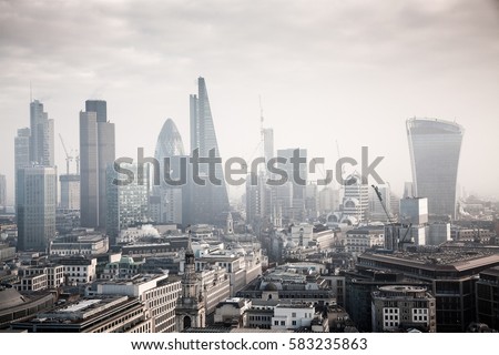 rooftop view over London on a foggy day from St Paul's cathedral, UK