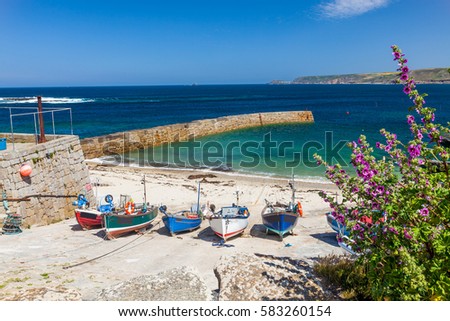 Small fishing boats in the harbour at Sennen Cove Cornwall England UK Europe