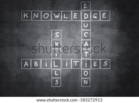 Business concept with crossword drawn on blackboard