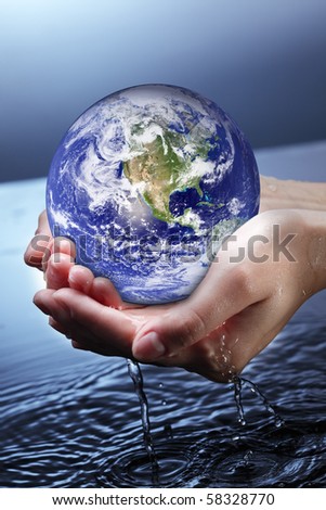 globe in woman hand