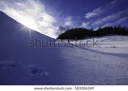 professional photographer making pictures of the mountain in winter