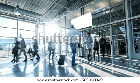 Blurred People at a European trade fair entrance 