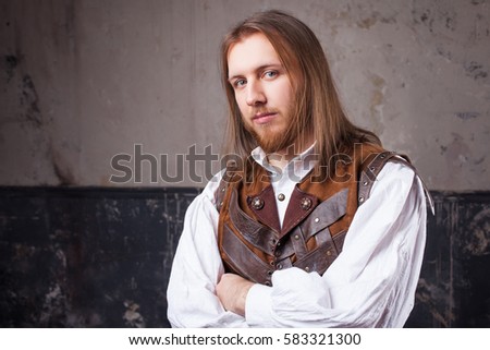Handsome male Steam punk. Retro man portrait over grunge background.