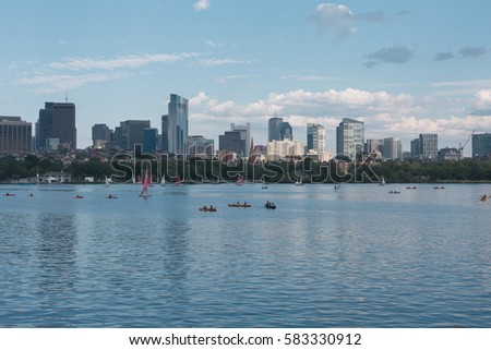 People Sailing in Boston's Charles River in Summer with Downtown Boston in Background
