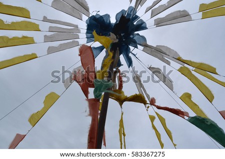Tibetan umbrella with color flags