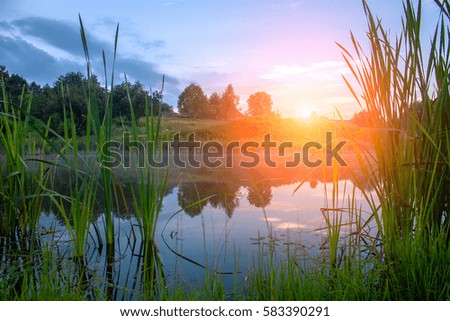sunset on the lake in the summer, background