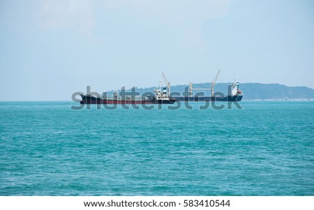Soft focused picture of two merchant ships parking port in Phuket Thailand