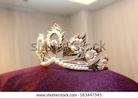 Miss Pageant Crown with Jewelry Diamond Pearl Silver Gold Ruby on Cushion Pillow in exhibition