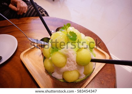 Green melon bingsu (syrup ice flake with fruit) in melon 