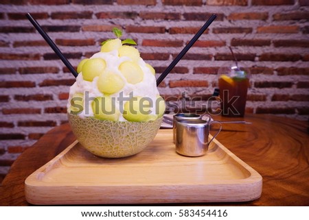 Green melon bingsu (syrup ice flake with fruit) in melon 