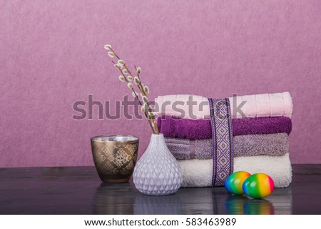 Wellness Easter concept. Set towels in blue colors, rabbit, nuts and branches with kidneys Royalty-Free Stock Photo #583463989