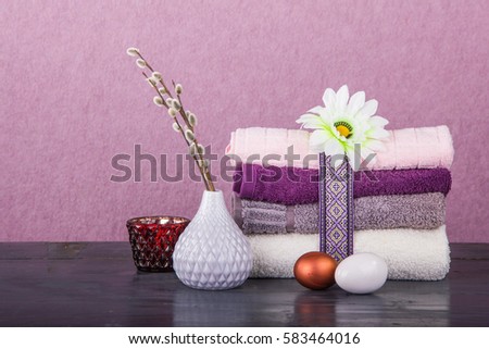 Wellness Easter concept. Set towels in blue colors, rabbit, nuts and branches with kidneys Royalty-Free Stock Photo #583464016