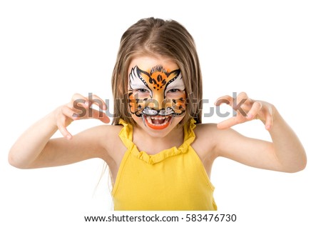 cute little girl growling like tiger with colorful painted face isolated on white background Royalty-Free Stock Photo #583476730