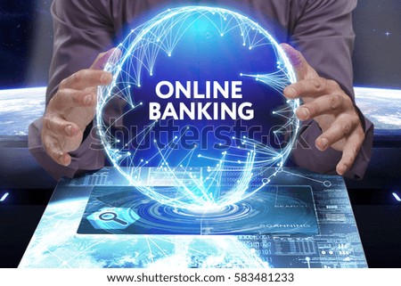 Business, Technology, Internet and network concept. Young businessman shows the word on the virtual display of the future: Online banking