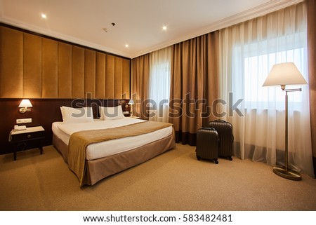 traveling bag in the hotel room Royalty-Free Stock Photo #583482481
