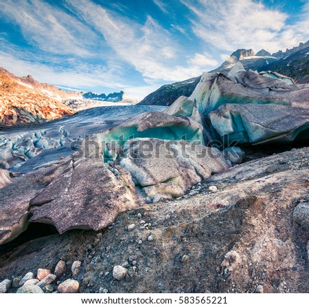 Unbelievable summer view of the Rhone glacier. Sunny morning scene in Swiss Alps, Bern canton, Switzerland, Europe. Melting ice in the mountains. Beauty of nature concept background.

