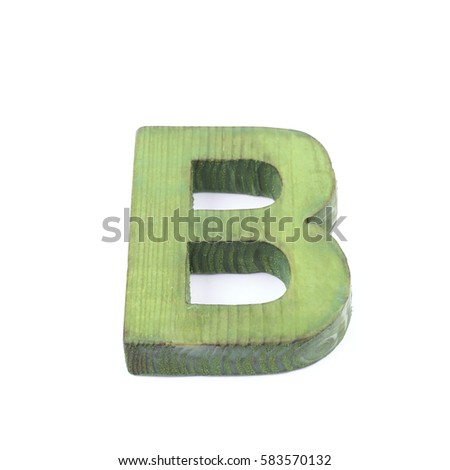 Single sawn wooden letter B symbol coated with paint isolated over the white background