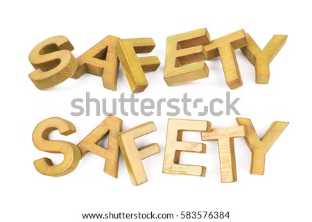 Word Safety made of colored with paint wooden letters, composition isolated over the white background, set of two different foreshortenings