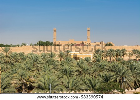 Historic buildings and palm trees in Dariyah clay castle, also as Dereyeh and Dariyya, a town in Riyadh, Saudi Arabia, original home of the Saudi royal family, the capital of the Emirate of Diriyah.