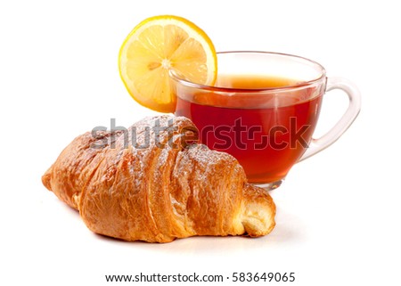 croissant with a cup of tea isolated on white background closeup