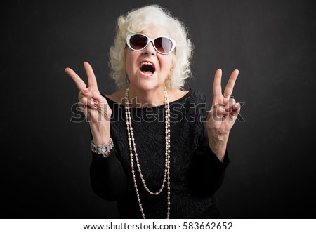 Cool grandma showing peace sign 