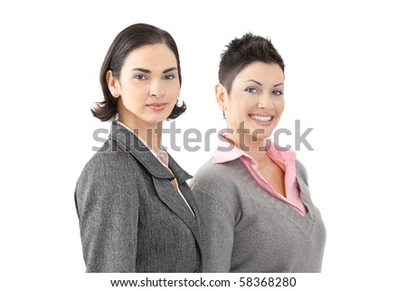 Happy young businesswomen smiling, isolated on white background.