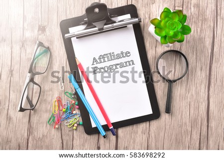 Clipboard with text written on paper - BUSINESS CONCEPT