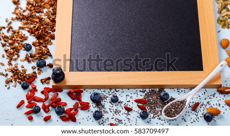 Ingredients for cooking Granola. Food or Healthy diet concept.Breakfast with various cereals and muesli, cereal seeds and nuts on a wooden background.Copy space for Text.selective focus.