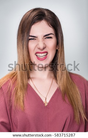 Portrait of angry young woman.
