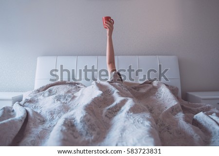 morning coffee in bed Royalty-Free Stock Photo #583723831